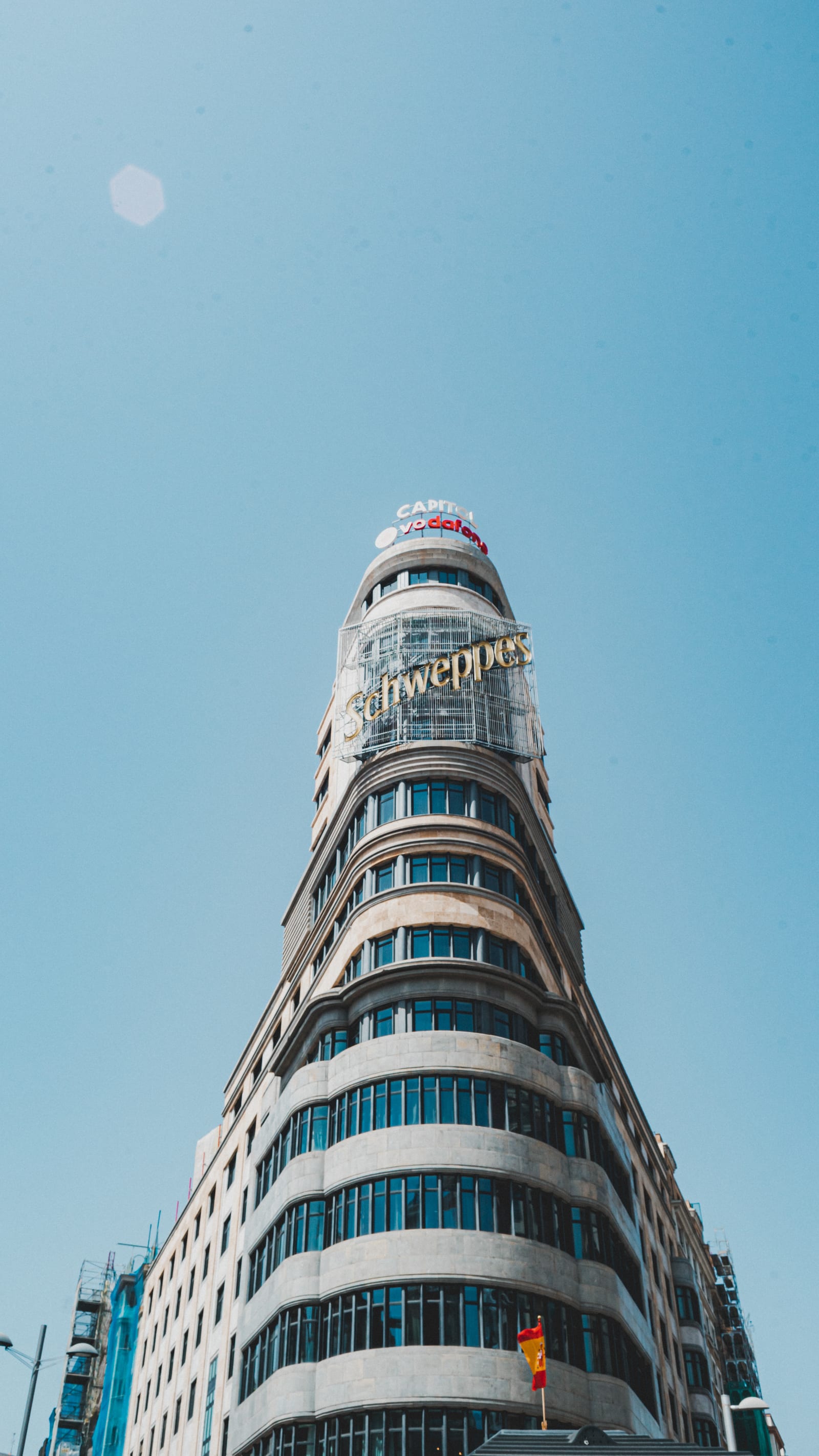 Rounded corner tower against a clear blue sky
