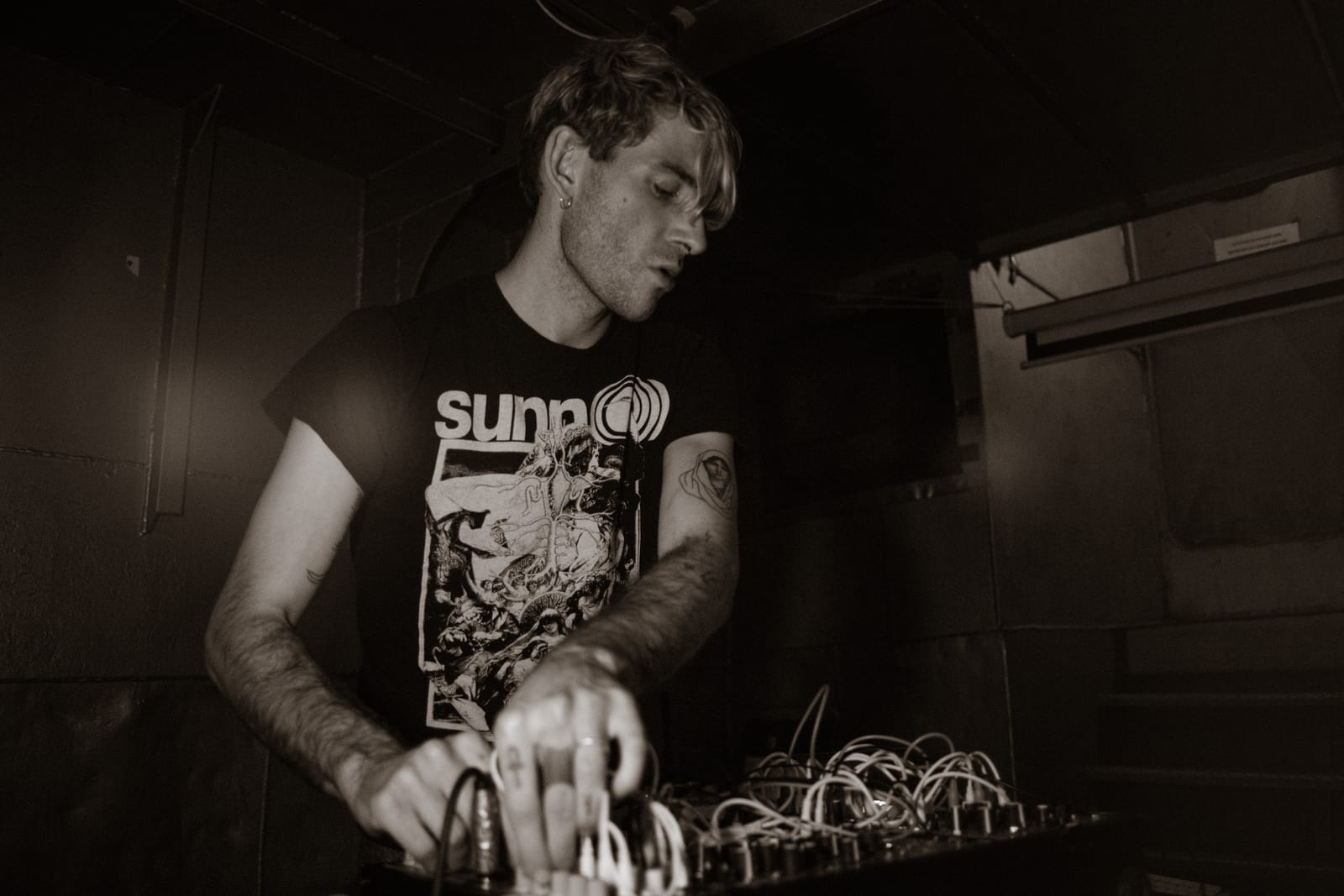 DJ at the decks, in sepia