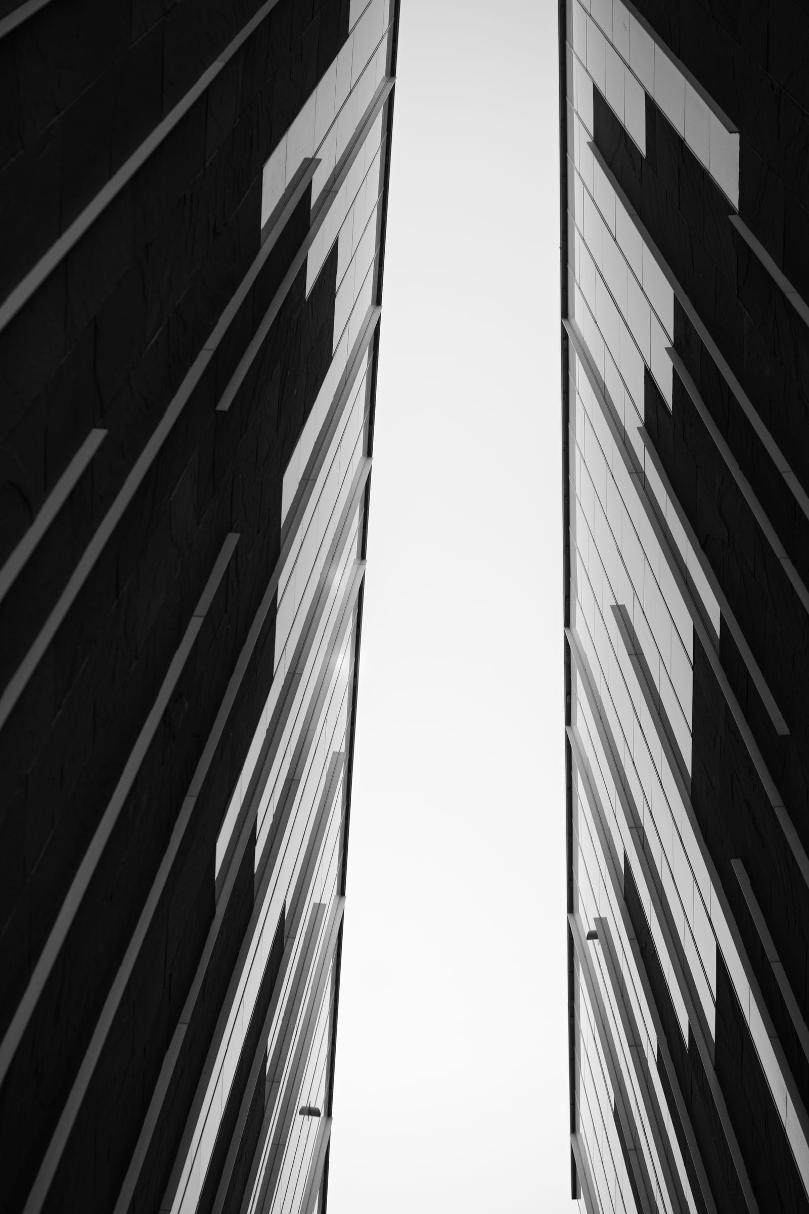 Abstract upward view between two angular facades